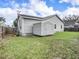 Exterior side view of the home and matching storage shed in the back yard at 1003 W Reynolds St, Plant City, FL 33563