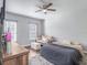 Bedroom with ceiling fan, ensuite sitting area, and hardwood floors at 1003 W Reynolds St, Plant City, FL 33563