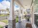 View from the porch, shows a home with rocking chairs, brick columns, and walkway at 1003 W Reynolds St, Plant City, FL 33563