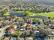 An aerial view pinpoints a beautiful single-Gathering home within a neighborhood near a golf course and pond at 11218 Longbrooke Dr, Riverview, FL 33579
