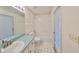 Bathroom featuring a shower/tub combo and vanity with ample storage at 11218 Longbrooke Dr, Riverview, FL 33579