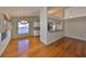 Open concept dining area featuring hardwood floors, chandelier lighting, and bar top access to the kitchen at 11218 Longbrooke Dr, Riverview, FL 33579