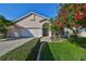Charming single-Gathering home with a two car garage, beautiful flowering tree and well maintained lawn at 11218 Longbrooke Dr, Riverview, FL 33579