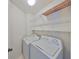 Laundry room with washer, dryer, and shelving at 11218 Longbrooke Dr, Riverview, FL 33579