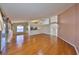Open living room with hardwood floors, high ceilings, and sliding glass doors to the exterior at 11218 Longbrooke Dr, Riverview, FL 33579
