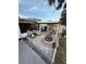 Charming backyard with a fire pit, outdoor seating, and a covered patio at 1149 6Th Ne Ave, Largo, FL 33770