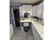 Updated bathroom vanity with bright white cabinets, granite counters, makeup station, and updated lighting at 1149 6Th Ne Ave, Largo, FL 33770