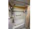 Bathroom featuring tub with shower and decorative white subway tile surround at 1149 6Th Ne Ave, Largo, FL 33770