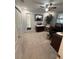 Carpeted bedroom featuring closet, window, and ceiling fan at 1149 6Th Ne Ave, Largo, FL 33770