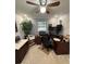 Carpeted bedroom featuring a ceiling fan, computer desk, and plenty of light at 1149 6Th Ne Ave, Largo, FL 33770