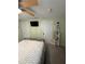 Cozy bedroom with light green walls, ceiling fan, and a comfy bed at 1149 6Th Ne Ave, Largo, FL 33770