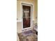 Front door featuring a glass panel, rug, a storm door, and a shoe rack at 1149 6Th Ne Ave, Largo, FL 33770