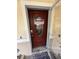 Close up of front door with decorative glass and patriotic welcome sign at 1149 6Th Ne Ave, Largo, FL 33770