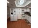 Well-lit kitchen with white appliances, cabinets, granite counters, and modern accents at 1149 6Th Ne Ave, Largo, FL 33770