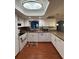 Bright kitchen with white cabinetry, modern appliances, and eat-in counter at 1149 6Th Ne Ave, Largo, FL 33770