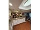 Open kitchen boasts granite countertops, pendant lighting, and views into the dining area at 1149 6Th Ne Ave, Largo, FL 33770