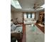 Living room with skylight, ceiling fan, and comfortable seating arrangement at 1149 6Th Ne Ave, Largo, FL 33770