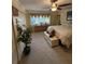 Well-lit bedroom featuring a decorative plant, dresser, and a comfortable bed at 1149 6Th Ne Ave, Largo, FL 33770