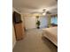 Spacious bedroom with ample closet space, TV, and ceiling fan at 1149 6Th Ne Ave, Largo, FL 33770