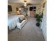 Large main bedroom boasts TV, ceiling fan, and views into en suite bathroom at 1149 6Th Ne Ave, Largo, FL 33770