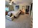 Cozy primary bedroom with large window, ceiling fan, and neutral decor at 1149 6Th Ne Ave, Largo, FL 33770