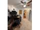 Bright office space with dark wood desk, comfortable chair, and ceiling fan at 1149 6Th Ne Ave, Largo, FL 33770