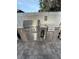 A stainless steel outdoor kitchen with granite countertops offers a stylish space for grilling and food preparation at 1149 6Th Ne Ave, Largo, FL 33770
