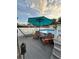 Relaxing pool deck with comfortable lounge chairs, an umbrella, and a hammock overlooking the pool at 1149 6Th Ne Ave, Largo, FL 33770