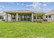 Expansive backyard and covered patio perfect for outdoor relaxation and entertainment at 11842 Richmond Trl, Parrish, FL 34219