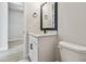 Modern bathroom featuring sleek white fixtures, quartz countertops, and contemporary design at 11842 Richmond Trl, Parrish, FL 34219