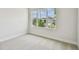 A bedroom with large windows offering views of the surrounding neighborhood at 11842 Richmond Trl, Parrish, FL 34219