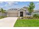 Beautiful single Gathering home with a well-manicured lawn and stone accents at 11842 Richmond Trl, Parrish, FL 34219