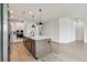 Bright kitchen with a large island, stainless appliances, and ample counter space at 11842 Richmond Trl, Parrish, FL 34219
