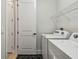 Convenient laundry area with a modern washer and dryer, and a stylish patterned floor at 11842 Richmond Trl, Parrish, FL 34219