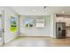 Bright living room with a door to the outside patio at 11842 Richmond Trl, Parrish, FL 34219