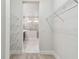 Walk-in closet providing direct access to the ensuite bathroom and ample storage at 11842 Richmond Trl, Parrish, FL 34219