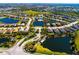 Breathtaking aerial view of the community, showcasing mature trees, ponds, and manicured landscaping at 12031 Medley Ter, Lakewood Ranch, FL 34211