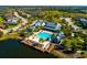 Aerial view of the community clubhouse, pool, and lake at 12031 Medley Ter, Lakewood Ranch, FL 34211
