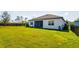 Large backyard featuring well-manicured lawn, a privacy fence, and a covered patio at 12031 Medley Ter, Lakewood Ranch, FL 34211