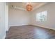 Bedroom with wood-look tile flooring and window at 12031 Medley Ter, Lakewood Ranch, FL 34211