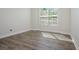 Bedroom with wood-look tile flooring and window at 12031 Medley Ter, Lakewood Ranch, FL 34211