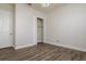 Neutral bedroom offers wood-look flooring, white trim, and a closet for ample storage at 12031 Medley Ter, Lakewood Ranch, FL 34211