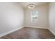 Bedroom with wood-look tile flooring and window at 12031 Medley Ter, Lakewood Ranch, FL 34211