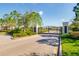 Gated entrance to the community with manicured landscaping and security features at 12031 Medley Ter, Lakewood Ranch, FL 34211