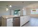 Open kitchen featuring white cabinets, granite countertops, stainless steel appliances and an island with a sink at 12031 Medley Ter, Lakewood Ranch, FL 34211