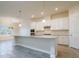 Bright kitchen features white cabinetry, granite countertops, stainless steel appliances, and a center island at 12031 Medley Ter, Lakewood Ranch, FL 34211