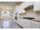 Bright kitchen features white cabinets, granite countertops, subway tile backsplash, and stainless steel appliances at 12031 Medley Ter, Lakewood Ranch, FL 34211