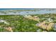 Scenic aerial view featuring a cluster of well-maintained buildings nestled within a lush green landscape near the water at 12760 Indian Rocks Rd # 532, Largo, FL 33774