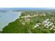 Expansive aerial view showcasing lush greenery, waterfront access, and well-maintained community buildings at 12760 Indian Rocks Rd # 532, Largo, FL 33774