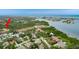 Aerial view of waterfront neighborhood with lush trees, community buildings, and various amenities at 12760 Indian Rocks Rd # 532, Largo, FL 33774